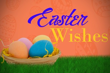 Composite image of colorful easter eggs in wicker basket 