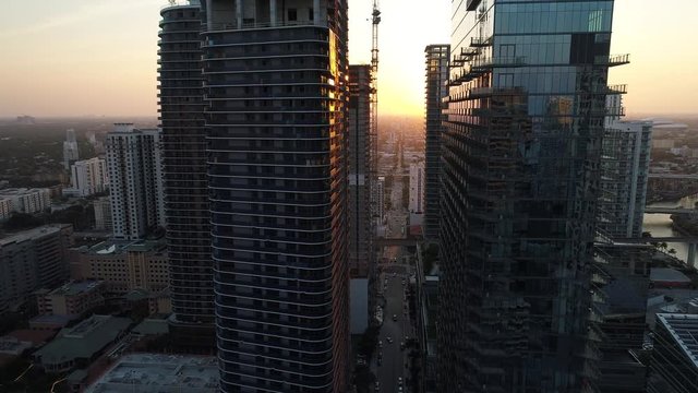 Aerial video sunset between buildings