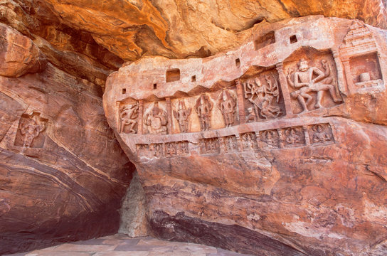 Sculptured wall with Hindu gods in natural cave of Badami town, India. Temple carvings made in 6th century, now Karnataka state