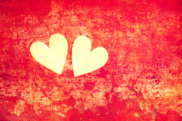 Symbols of love - hearts on the abstract red background. Creative art background