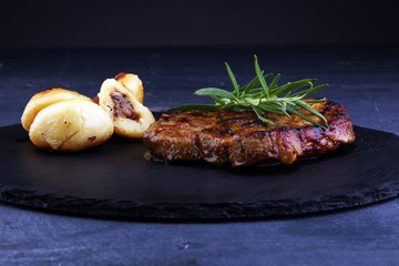 Grilled steaks, baked dumplings potatoes