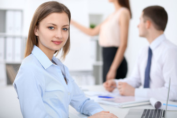 Fototapeta premium Portrait of a young business woman at meeting.