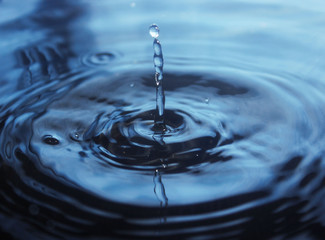 Beautiful splash of water drop on water surface