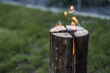 Swedish torch fire burning stub on plate for rest or to cook food chill mood