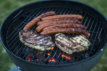 delicious grilled meat over coal on barbecue grill bbq