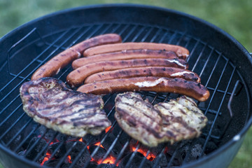 delicious grilled meat over coal on barbecue grill bbq
