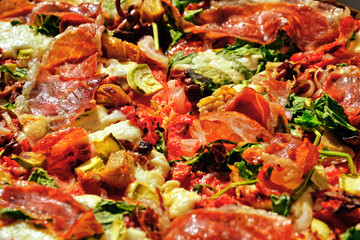 toppings pizza with prosciutto, vegetables
