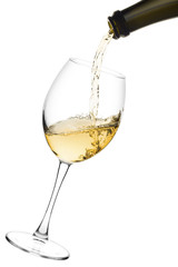 white wine poured from a bottle into wine glass on white background, isolated