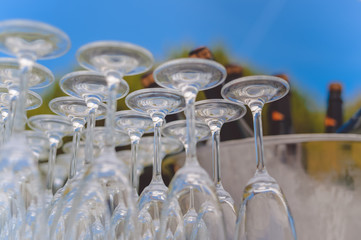 Catered service and tables ready for food eating event reception, busy light background