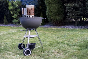kettle barbecue charcoal grill roasting BBQ standing on gras ready for action