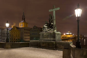 Fototapeta premium Night colorful snowy Prague Old Town with Sculptures from the Charles Bridge, Czech republic
