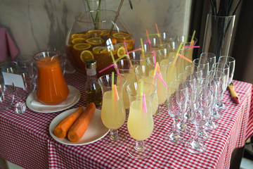 Fresh juice on a table in a restaurant. Healthy drinks. carrot f