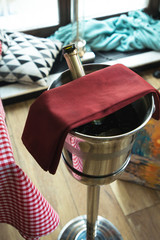 Bottle of champagne in bucket in a restaurant