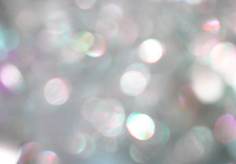 Obraz na płótnie Canvas Silver bokeh blurry shiny magic gleam glamour background