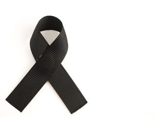 Black ribbon awareness on white background