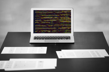 Fototapeta premium Laptop and documents on table in office