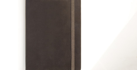 Black leather note book diary with stripee on white background