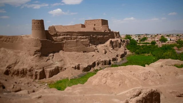 panorama of ancient fortress in the city of Meybod in Iran in sunny day, pise-walled fortress is on the hill above the city