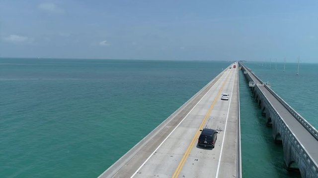 aerial views of ocean bridge at florida keys with cars