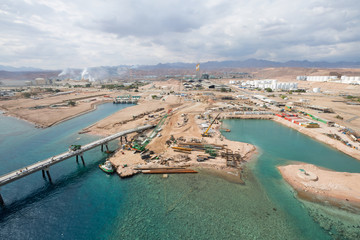Aqaba, Jordan, 10/10/2015, Metal and concrete Jetty foundation construction at the Aqaba new port photographed from above