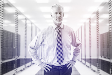 Senior businessman in server room