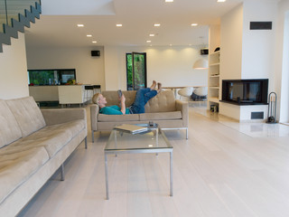 woman on sofa using tablet computer