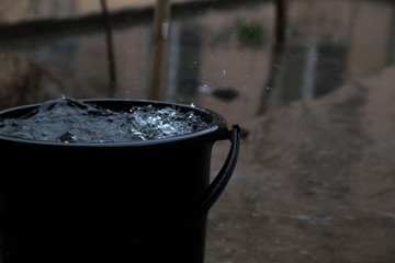 rain drop in bucket water, weather rainy season - obrazy, fototapety, plakaty