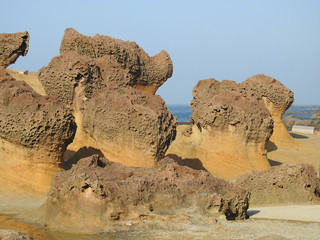 Fototapeta na wymiar Yehliu Geopark in Taiwan famed for its eroded rock formations with sea-erosion landscape.