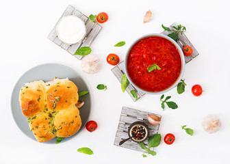 Traditional Ukrainian Russian vegetable borscht soup  on blue bowl. Flat lay. Top view
