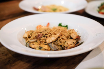 Seafood spaghetti in white dish