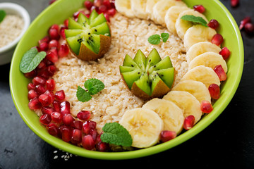 Tasty and healthy oatmeal porridge with fruit, berry and flax seeds. Healthy breakfast. Fitness food. Proper nutrition.