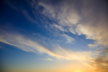 Naklejka na ściany i meble Blue sky, some clouds at sunset