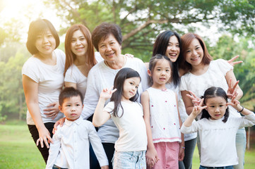Group of Asian multi generations family outdoors