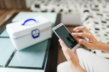 Woman using smartphone for buying drugs online pharmacy