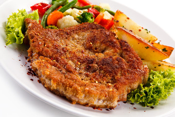 Fried pork chop with potatoes