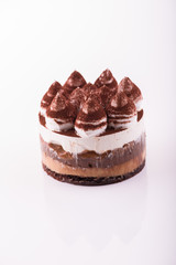 Sweet and tasty chocolate cake on the white background.