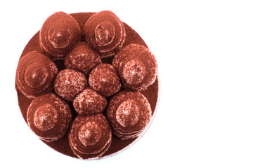 Sweet and tasty chocolate cake on the white background. Top view.