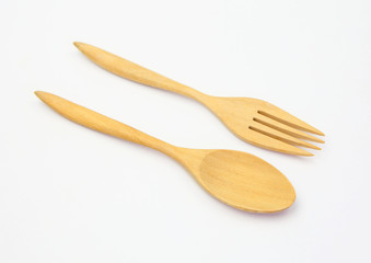 wooden spoon and fork on white background