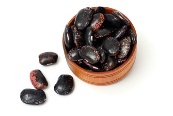 kidney beans on wood plate isolated on white background