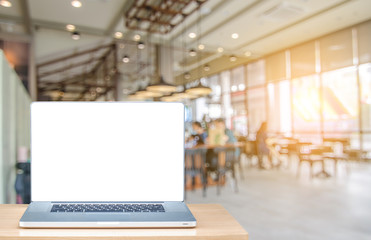 Side view laptop on desk work in coffee shop