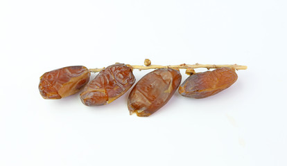 Sweet dried Date Palm fruit (Phoenix dactylifera) on White isolate background