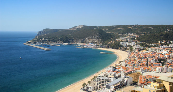 Beautiful view of Sesimbra beach in Portugal at the sunset