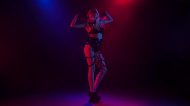 Blonde showgirl pj is dancing in studio in slow motion