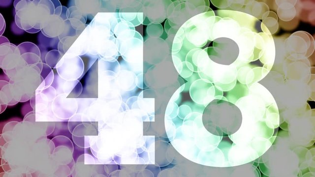 Forty eight to forty nine years birthday fade in/out animation with color gradient moving bokeh background. Animation: 90 frames still with number, 180 fade out, 30 clear, 180 fade in, 300 still.
