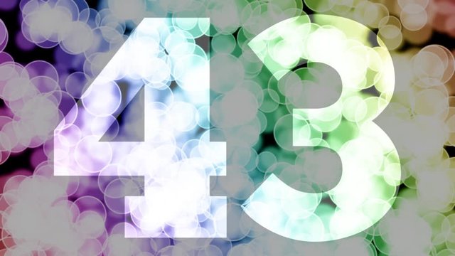 Forty three to forty four years birthday fade in/out animation with color gradient moving bokeh background. Animation: 90 frames still with number, 180 fade out, 30 clear, 180 fade in, 300 still.
