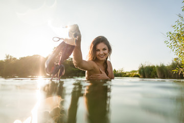 Flirtatious young woman removed her bra