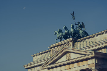 Fototapeta na wymiar Detail of the Brandenburg Gate. On top of the Brandenburg Tor or Gate stands the Quadriga statue.