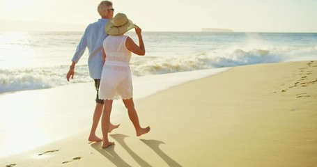Happy Couple Walking on the Beach at Sunset - Powered by Adobe