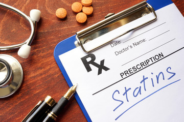 Clipboard with written prescription statins and stethoscope. - obrazy, fototapety, plakaty