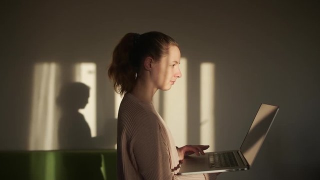 Girl using laptop Staying at Home befor the Train and Searching new Exercises 
